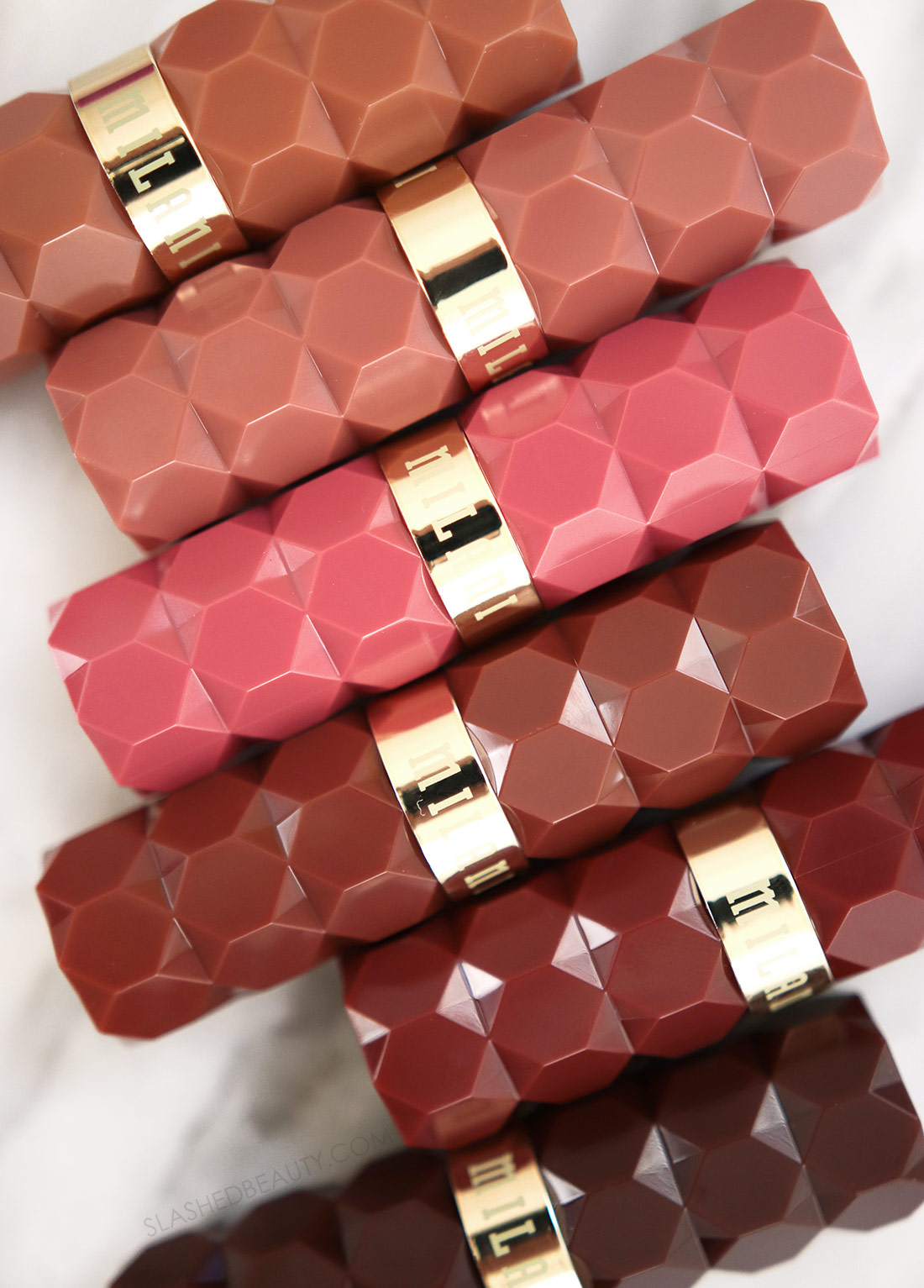milani-color-fetish-matte-nudes-review-swatches | Slashed Beauty Closed tubes of Milani Color Fetish Matte The Nudes Collection on a marble surface | Milani Color Fetish Matte The Nudes Collection Review & Swatches | Slashed Beauty